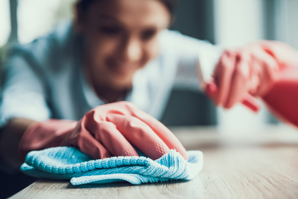 Young,smiling,woman,in,gloves,cleaning,house.,closeup,of,happy